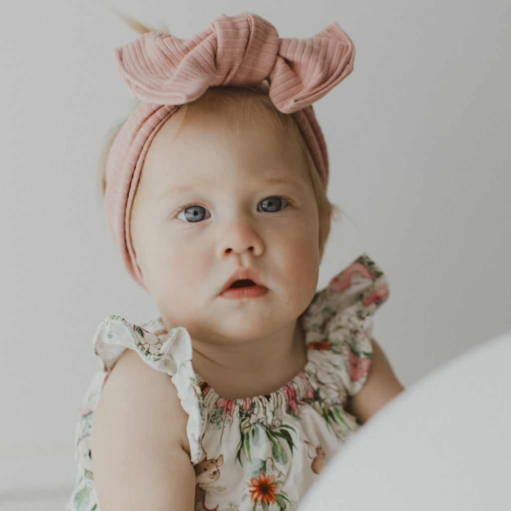 baby girl wearing handmade baby headband 